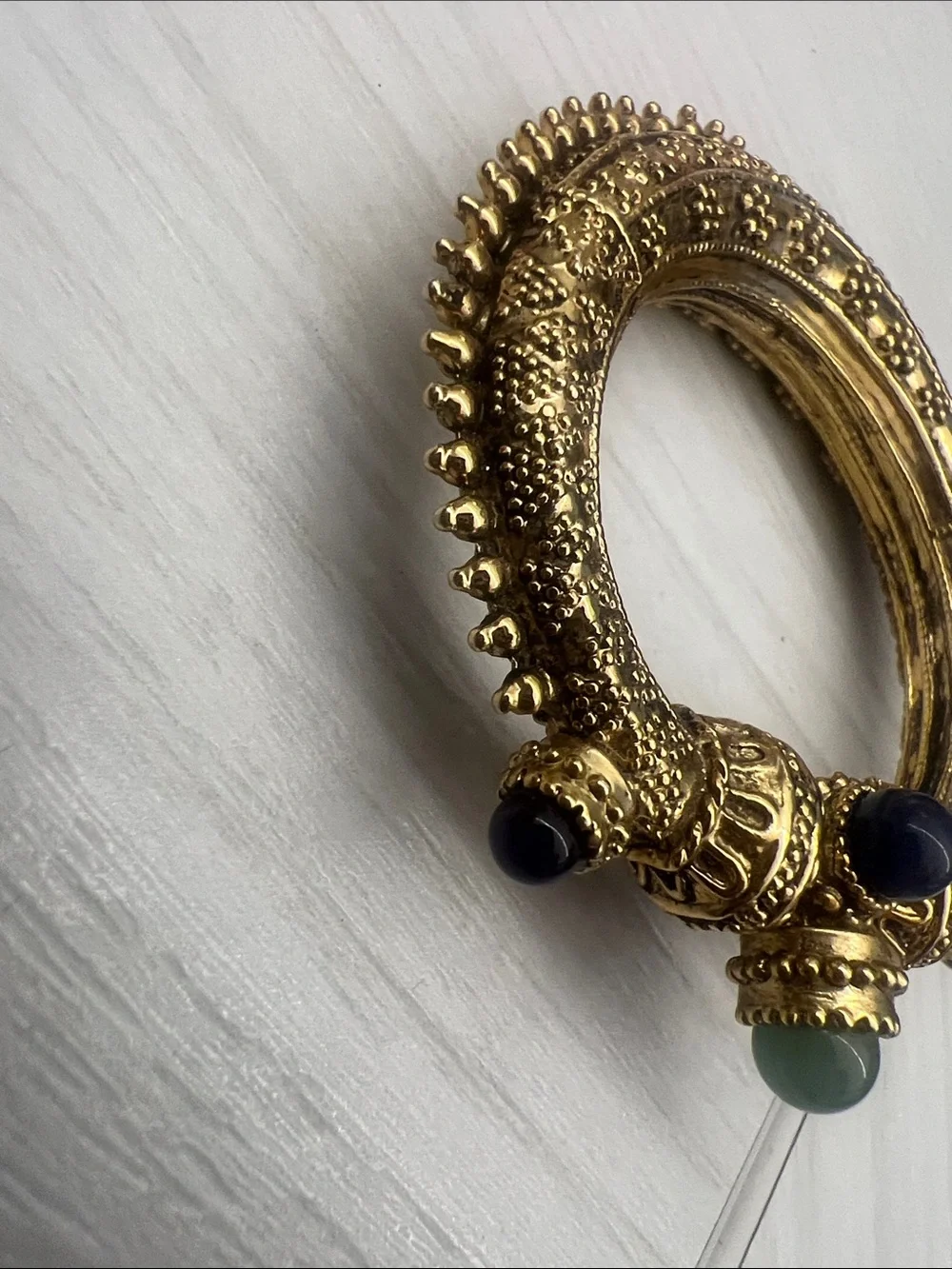 Gold-Tone Textured Hinged Bangle with Blue & Green Cabochons